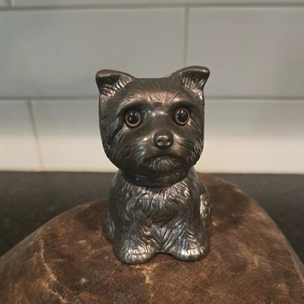 Vintage metal dog with glass eyes coin bank